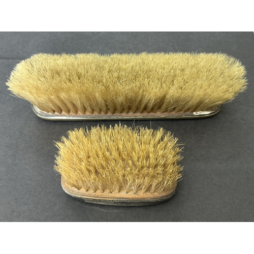 127 - Two hallmarked silver dressing table brushes