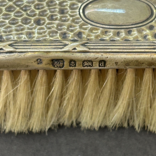 127 - Two hallmarked silver dressing table brushes