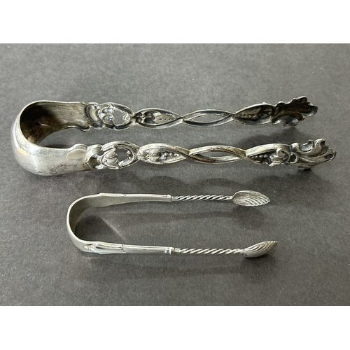 130 - Small hallmarked silver sugar nips, weight approx. 12g together with a pair of large white metal nip... 