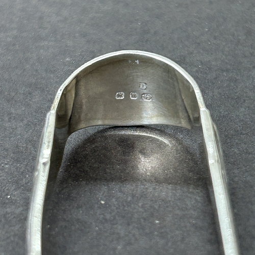 130 - Small hallmarked silver sugar nips, weight approx. 12g together with a pair of large white metal nip... 