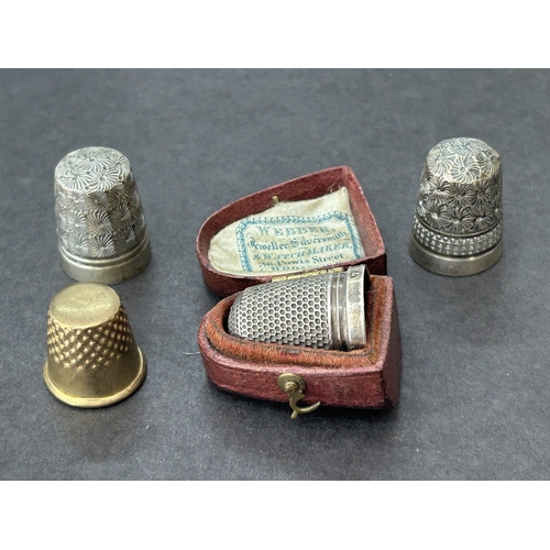 132 - A cased Charles Horner Chester silver thimble together with a Dorcas plated, a 'Pat 8' and one other
