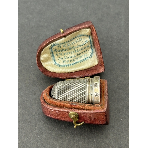 132 - A cased Charles Horner Chester silver thimble together with a Dorcas plated, a 'Pat 8' and one other