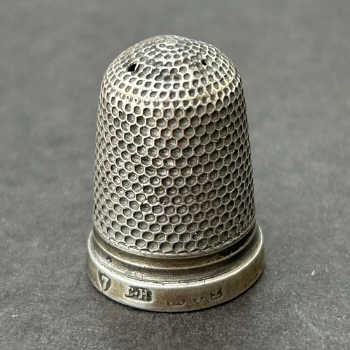 132 - A cased Charles Horner Chester silver thimble together with a Dorcas plated, a 'Pat 8' and one other