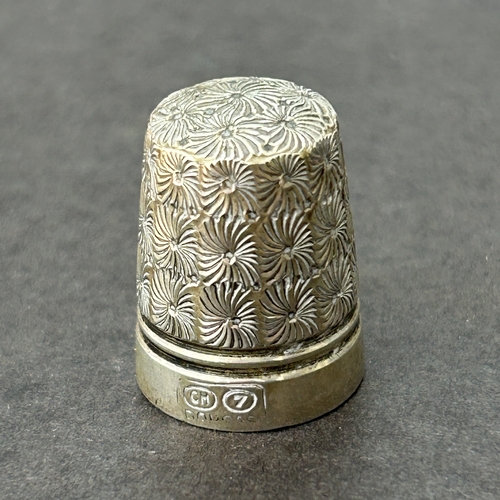 132 - A cased Charles Horner Chester silver thimble together with a Dorcas plated, a 'Pat 8' and one other
