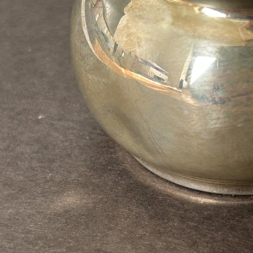 133 - A hallmarked silver small jug, weight approx. 42g (dent to one side)