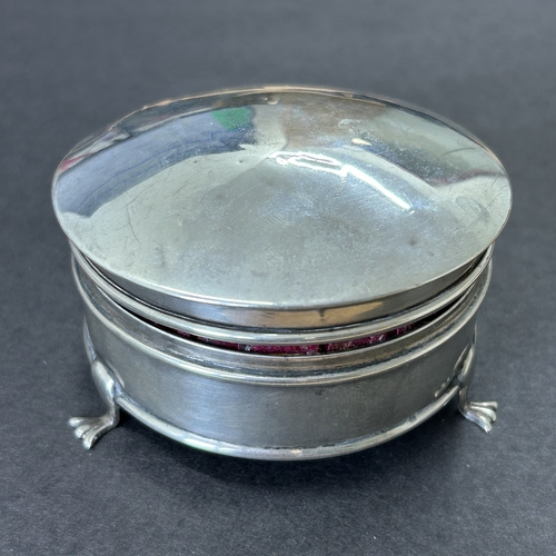 144 - A hallmarked silver and velvet lined trinket pot on three claw feet, weight approx. 35g