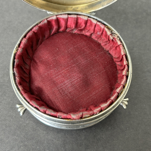 144 - A hallmarked silver and velvet lined trinket pot on three claw feet, weight approx. 35g