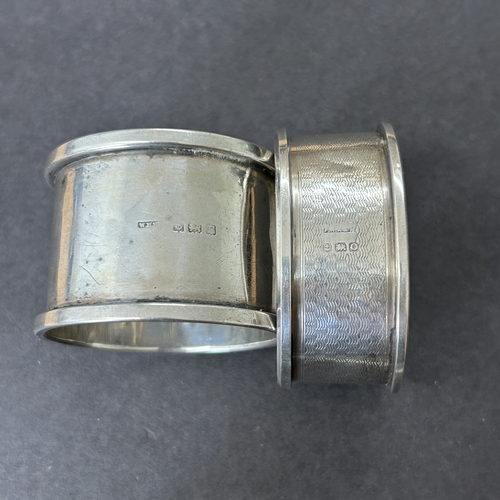 145 - A pair of hallmarked silver napkin rings together with two others, total weight approx. 46g