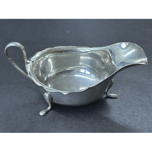 146 - A mid century hallmarked silver gravy boat, approx. 5 3/4