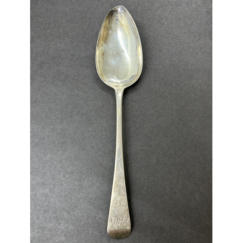 151 - A Georgian hallmarked silver table spoon, weight approx. 65g (bowl worn and dents)
