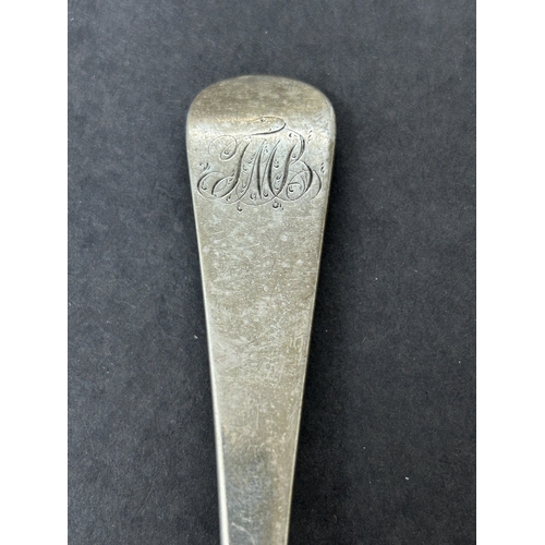 151 - A Georgian hallmarked silver table spoon, weight approx. 65g (bowl worn and dents)