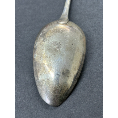 151 - A Georgian hallmarked silver table spoon, weight approx. 65g (bowl worn and dents)