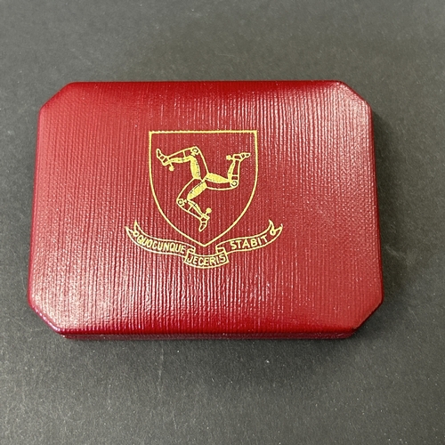 169 - A cased 1975 Pobjoy Mint Ltd sterling silver Isle-of-Man 'Manx cat crown' together with an Isle-of-M... 