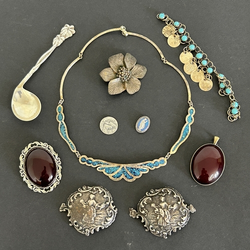 175 - A pair of hallmarked silver small plaques together with an 800 grade spoon, two Bakelite brooches an... 