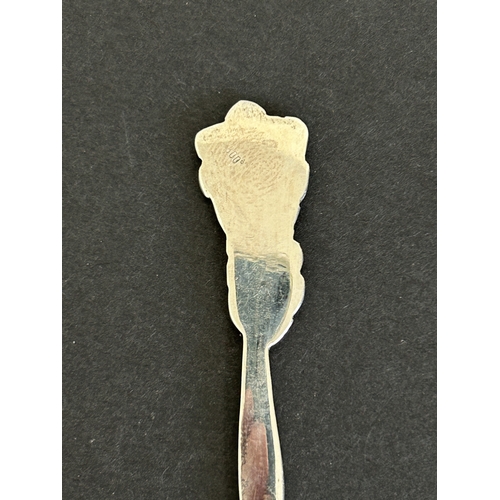 175 - A pair of hallmarked silver small plaques together with an 800 grade spoon, two Bakelite brooches an... 