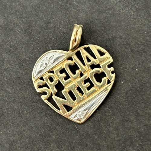 178 - A small yellow and white metal with diamond chip 'Special Niece' pendant, approx. 17mm long, weight ... 