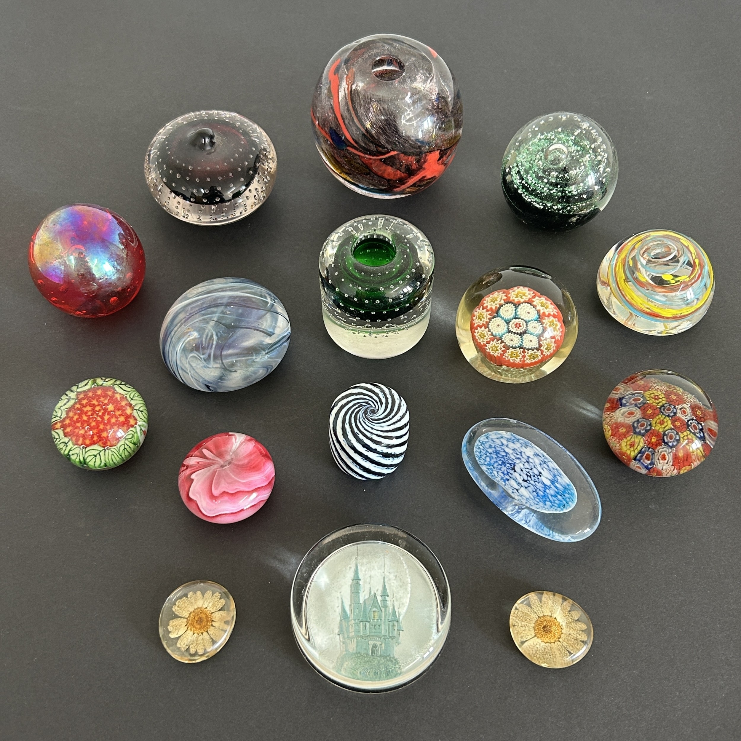 A collection of mixed paperweights etc