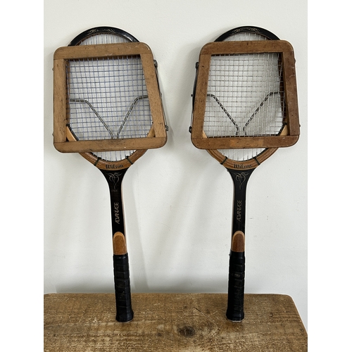 A pair of vintage Wilson Advantage tennis rackets with head covers