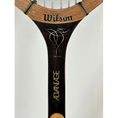 A pair of vintage Wilson Advantage tennis rackets with head covers