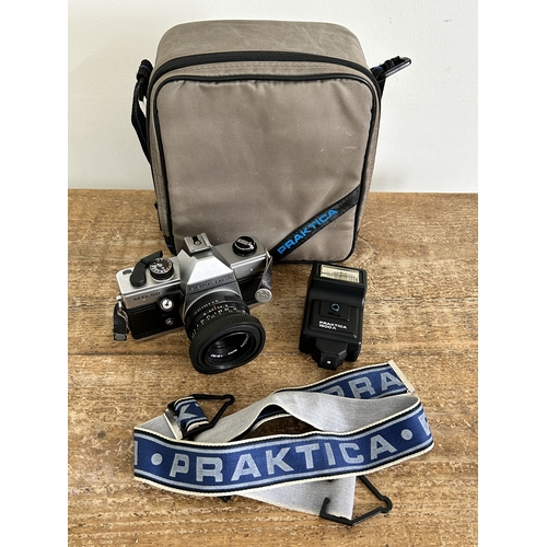 485 - A vintage Praktica MTL50 camera with flash etc housed in a Praktica case