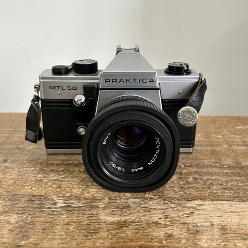 485 - A vintage Praktica MTL50 camera with flash etc housed in a Praktica case