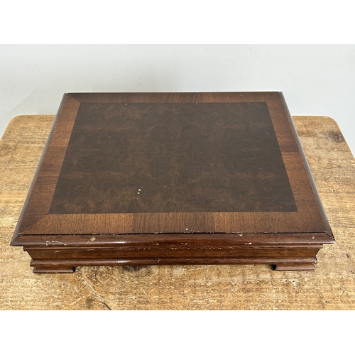 44 - A wooden cased canteen of Elkington silver plated six setting cutlery plus six extra non-matching te... 