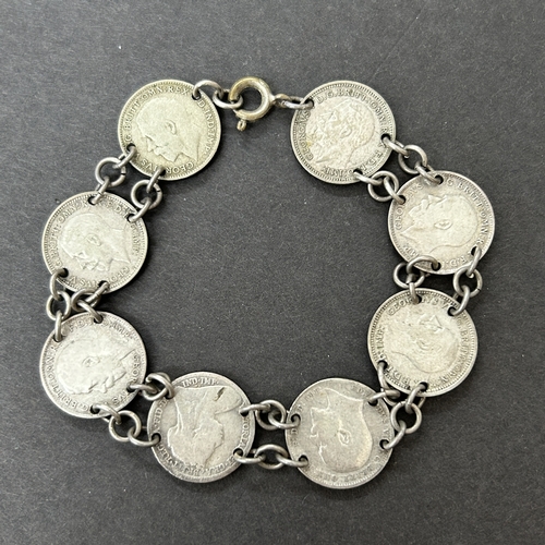 52 - Eight George V three pence coins set as a bracelet plus a 1934 coin ring, total weight approx. 17g