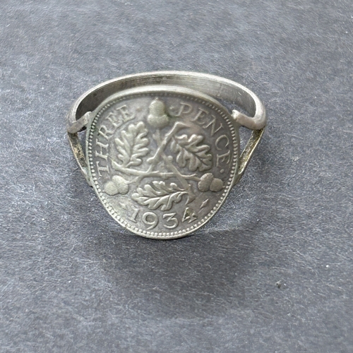 52 - Eight George V three pence coins set as a bracelet plus a 1934 coin ring, total weight approx. 17g