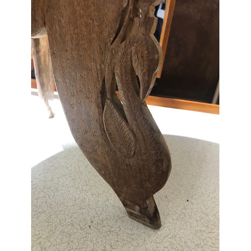 233 - Heavily carved Indian coffee table with foldable legs and removable inlaid top