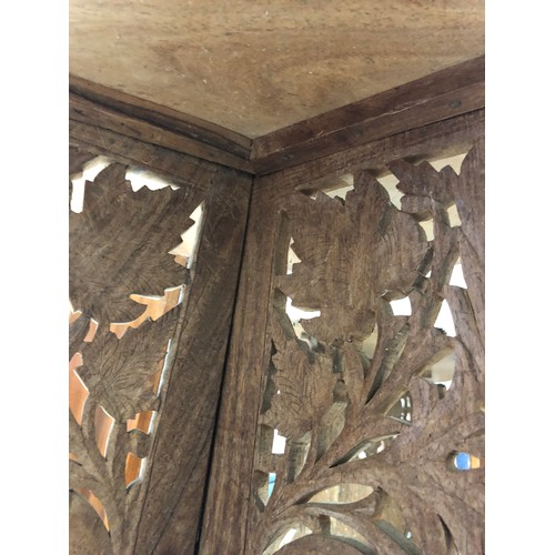 233 - Heavily carved Indian coffee table with foldable legs and removable inlaid top