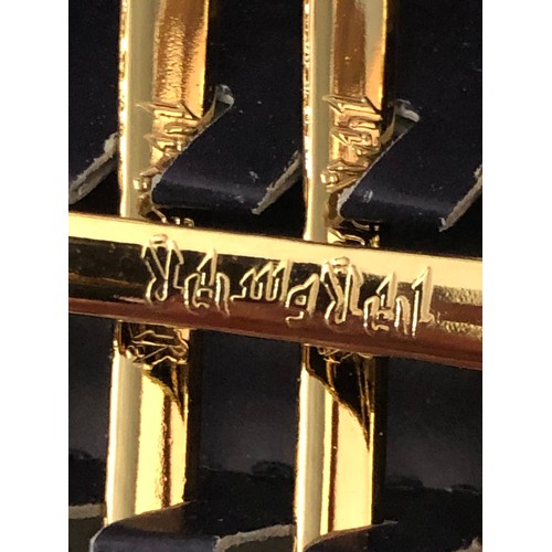 312 - Set of 12 interesting gold plated tea spoons.