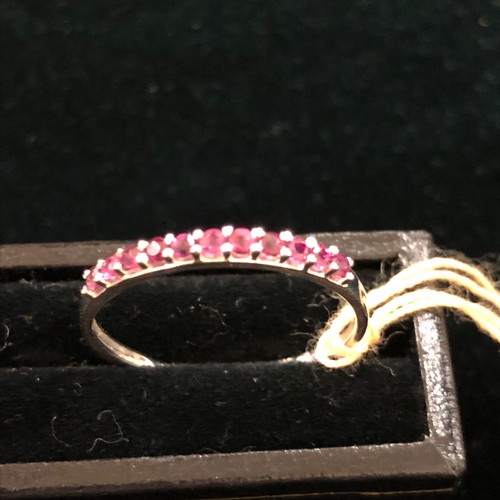 28 - 9ct White Gold Ruby 1/2 Eternity Ring. Size Q