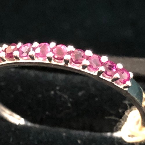 28 - 9ct White Gold Ruby 1/2 Eternity Ring. Size Q