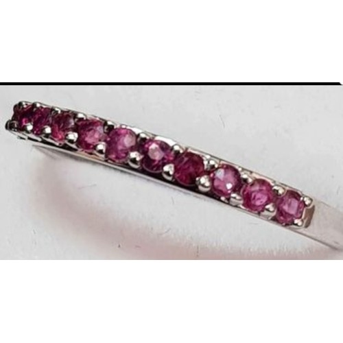 28 - 9ct White Gold Ruby 1/2 Eternity Ring. Size Q