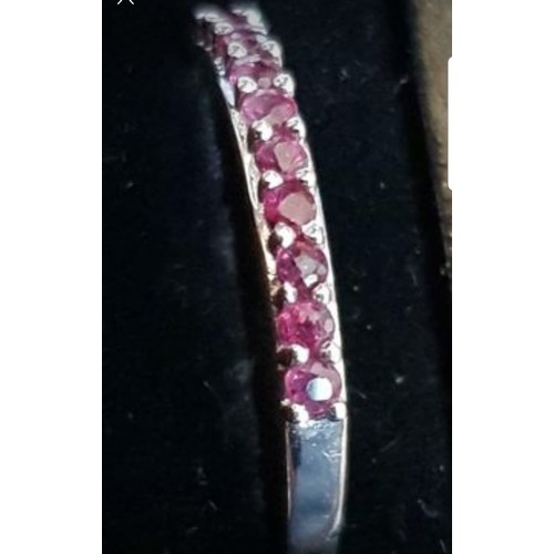 28 - 9ct White Gold Ruby 1/2 Eternity Ring. Size Q