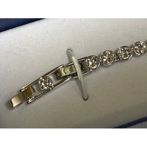 32 - Swarovski Crystal tennis bracelet with original box.
The tennis bracelet is a timeless classic and a... 