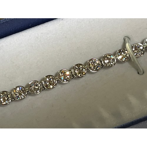 32 - Swarovski Crystal tennis bracelet with original box.
The tennis bracelet is a timeless classic and a... 