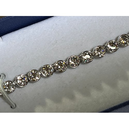 32 - Swarovski Crystal tennis bracelet with original box.
The tennis bracelet is a timeless classic and a... 