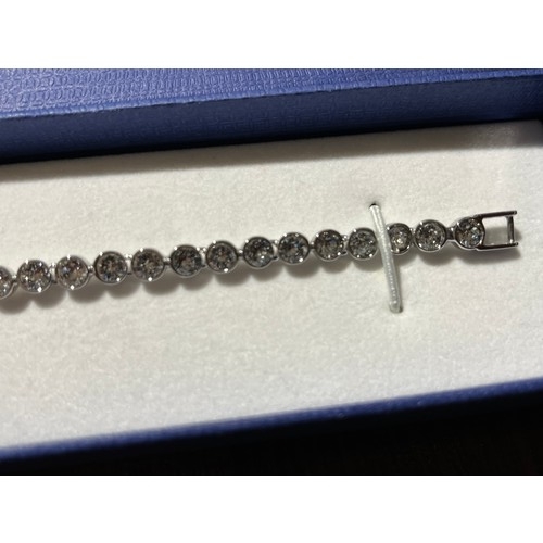 32 - Swarovski Crystal tennis bracelet with original box.
The tennis bracelet is a timeless classic and a... 