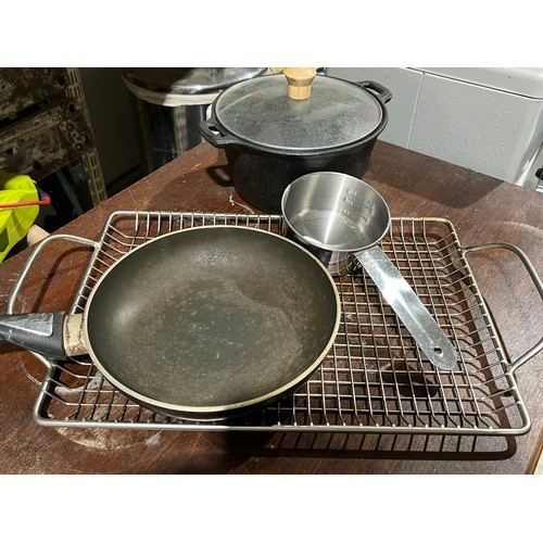 684 - Quantity of pans and grill for barbecue use. To include one heavy cast iron