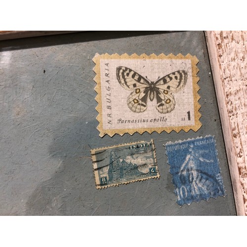 870 - Collage of interesting stamps along with hand painted bird framed.