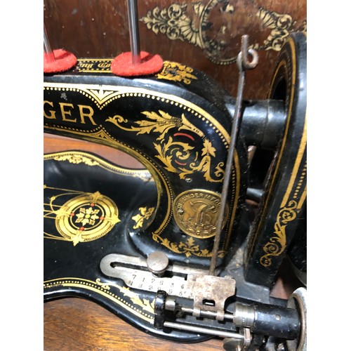 277 - Singer sewing machine with wooden case.