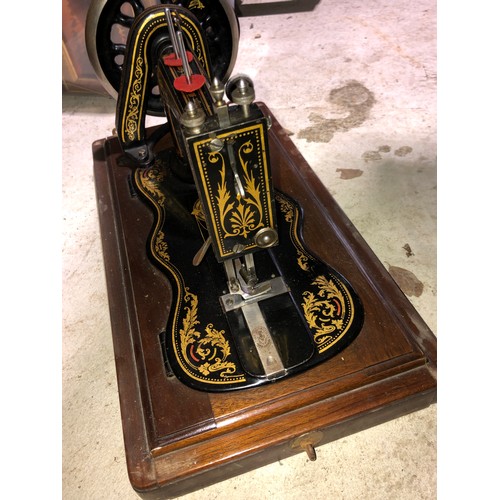 277 - Singer sewing machine with wooden case.