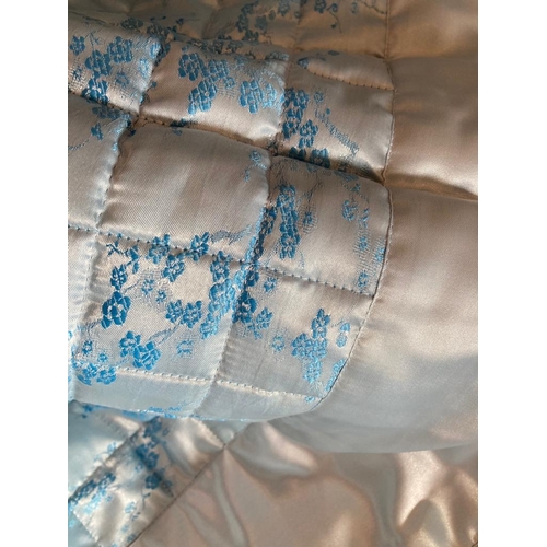 338 - Light blue oriental floral satin quilted bedspread