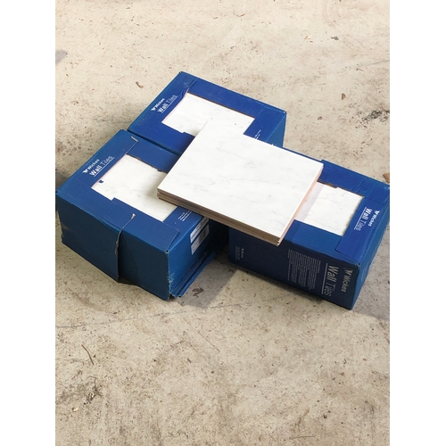 555 - 3 full boxes of 20 and 4 lose Wickes wall tiles in Florina grey with marble effect (64)