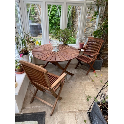 598 - Teak folding table and 2 teak folding chairs.