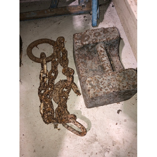 615 - 56 lb weight and a farm tractor chain with ring and hook.