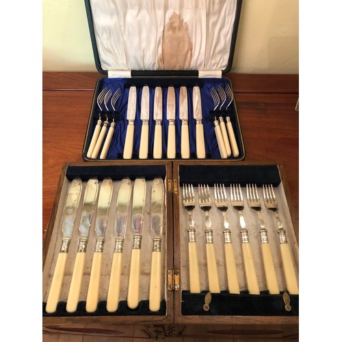 718 - 2 sets of fish knives