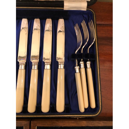 718 - 2 sets of fish knives