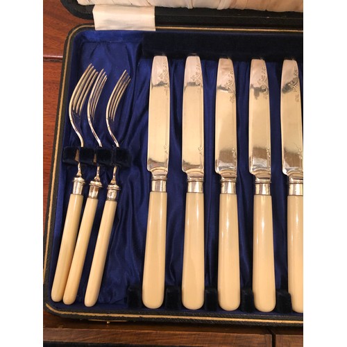 718 - 2 sets of fish knives